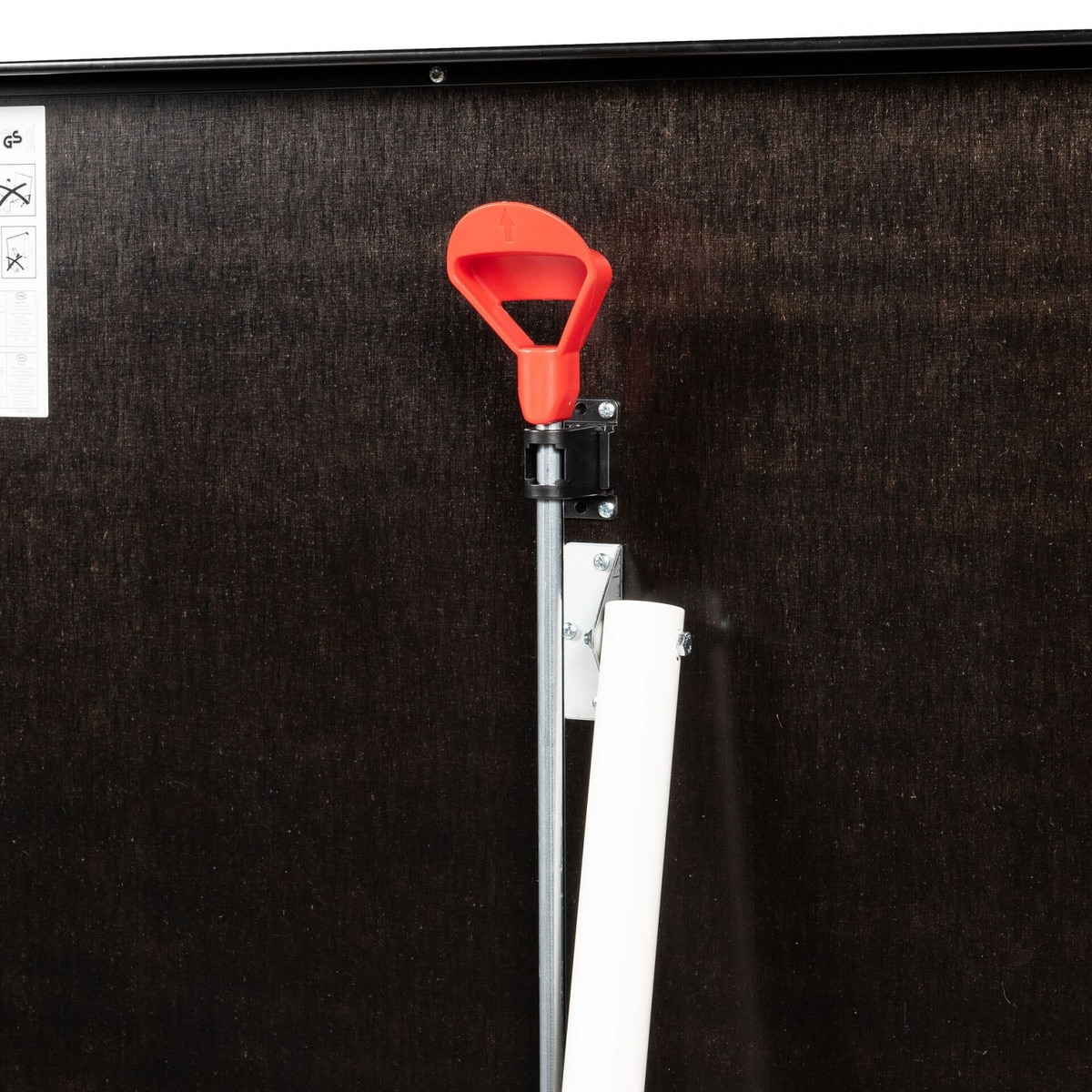 The Butterfly Timo Boll Repulse Indoor Ping Pong Table features a quick release locking mechanism with a red pull handle shown here to release the table from the storage position.